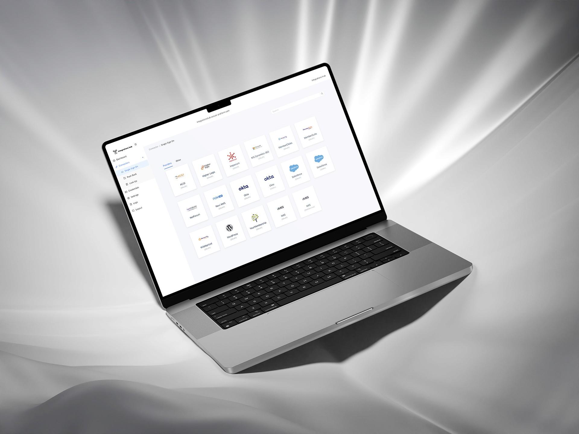 Integrations Hub platform displayed on a floating laptop.