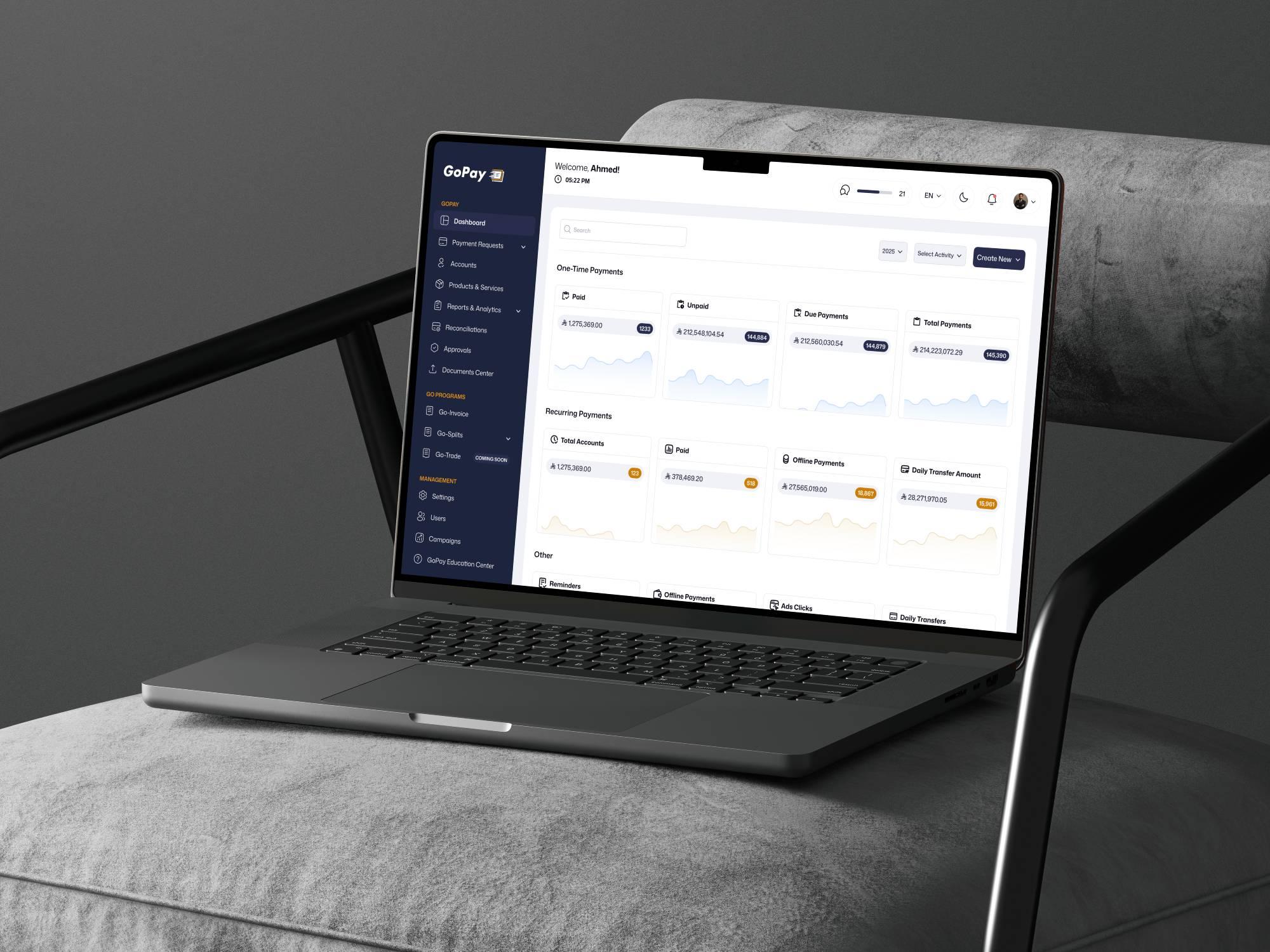 GoPay web dashboard displayed on a laptop.